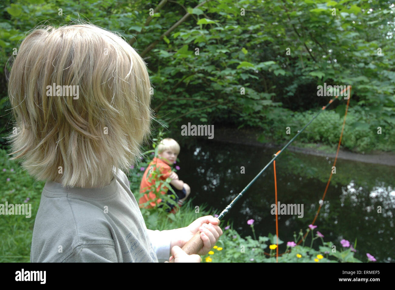 Two boys fishing in river hi-res stock photography and images - Alamy
