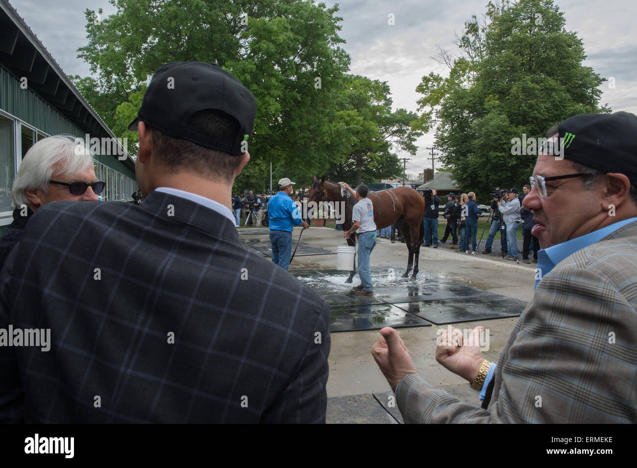 Elmont, New York, USA. 4th June, 2015. Trainer BOB BAFFERT (l), JUSTIN ZAYAT (c) and owner AHMED ZAYAT (r) look on as 2015 Belmont Stakes AMERICAN PHAROAH is bathed at Belmont Park, Thursday June 4, 2015. Credit:  Bryan Smith/ZUMA Wire/Alamy Live News Stock Photo