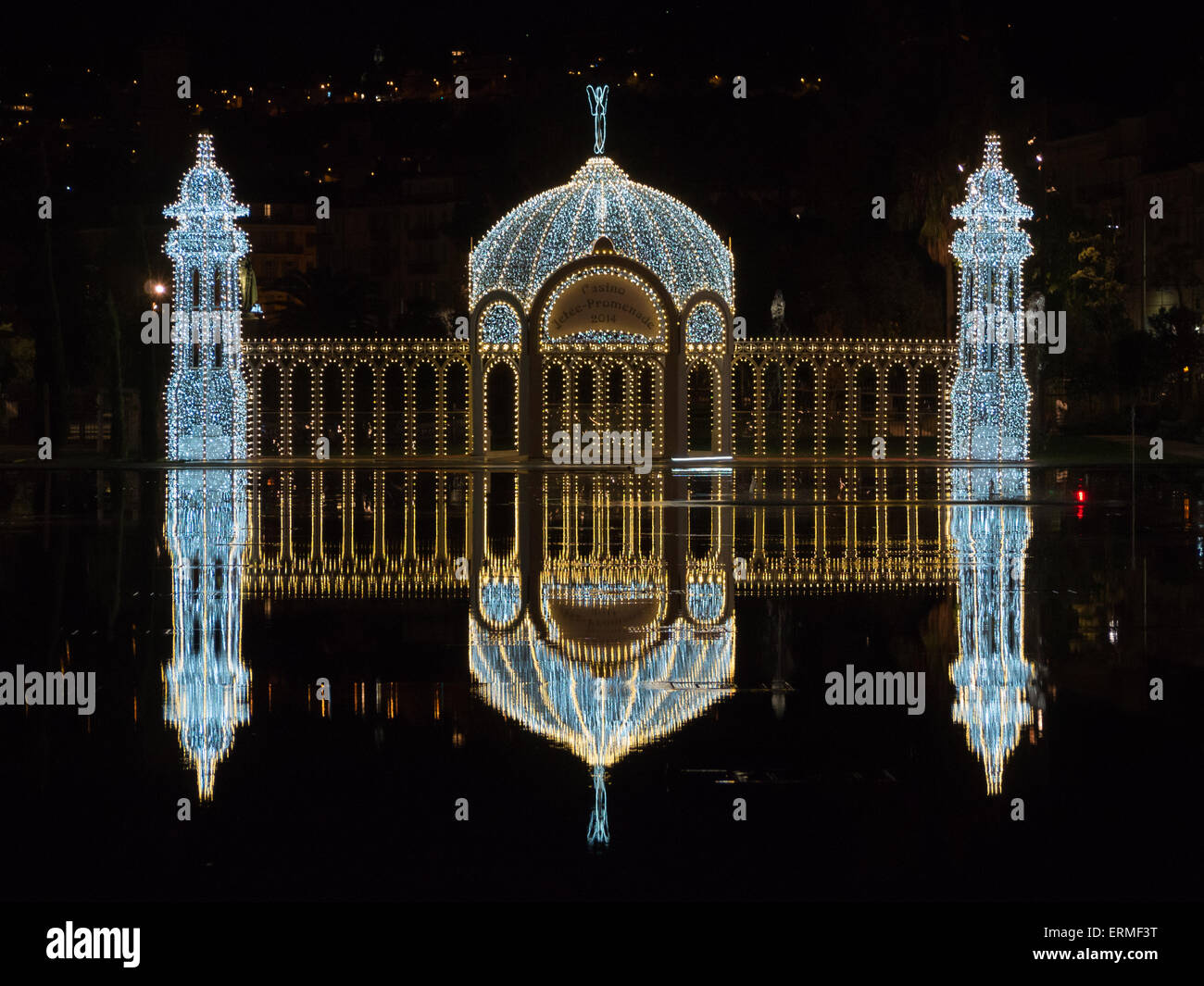 Light installation of Christmas palace refelcted in Nice's Miroir d'eau at Promenade du Paillon Stock Photo