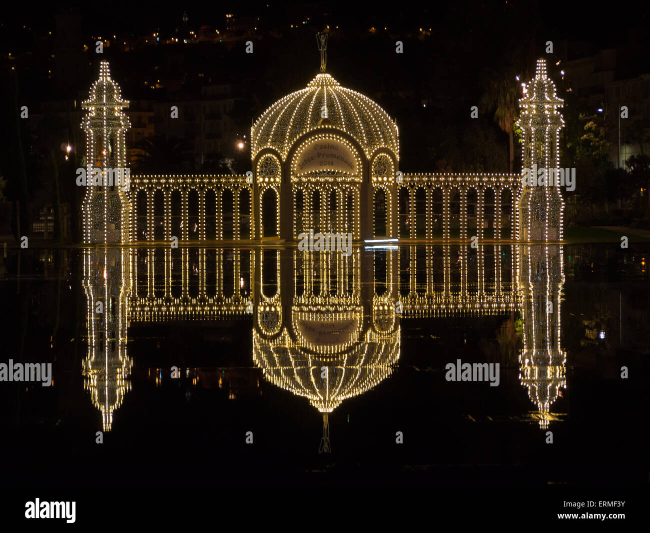 Light installation of Christmas palace refelcted in Nice's Miroir d'eau at Promenade du Paillon Stock Photo