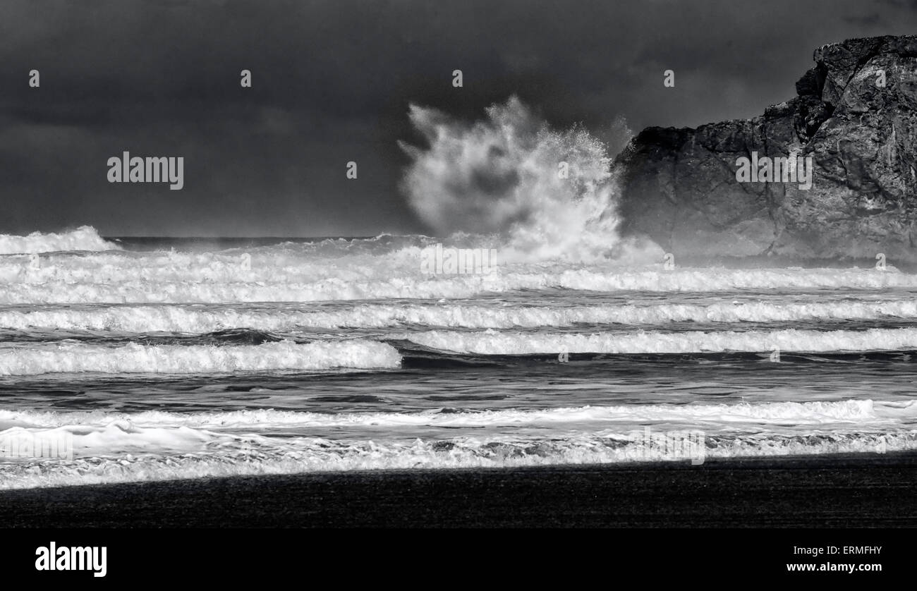 Black and White image of a giant wave crashing onto a cliff Stock Photo ...