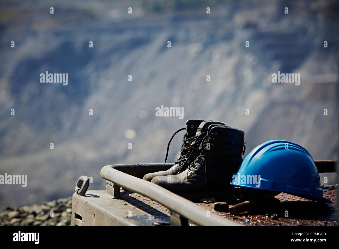 Work boots and a blue hard hat; Quebec, Canada Stock Photo Alamy