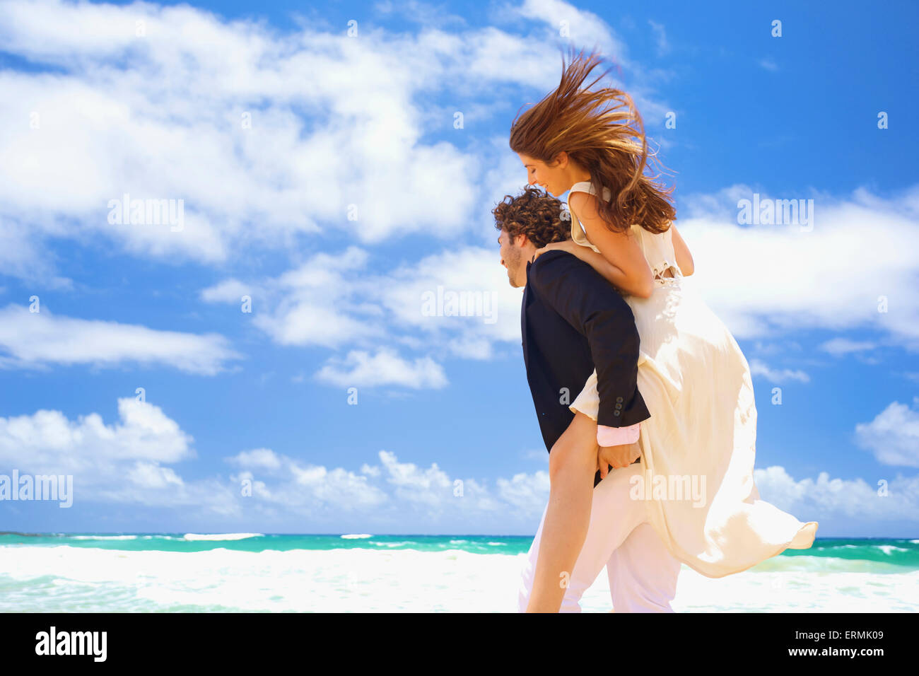 Couple on the beach; Kealia, Kauai, Hawaii, United States of America Stock Photo