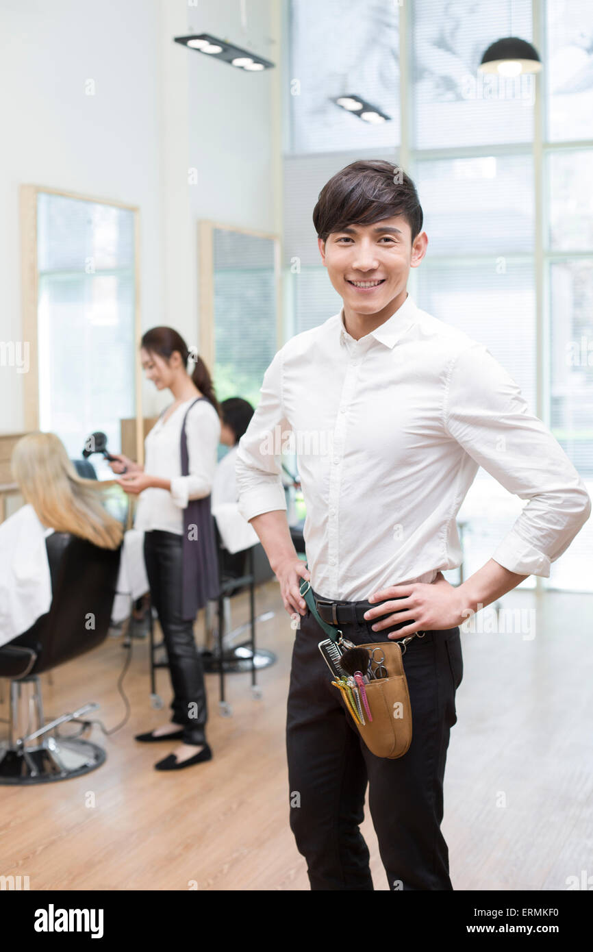 Barbers working in barber shop Stock Photo Alamy
