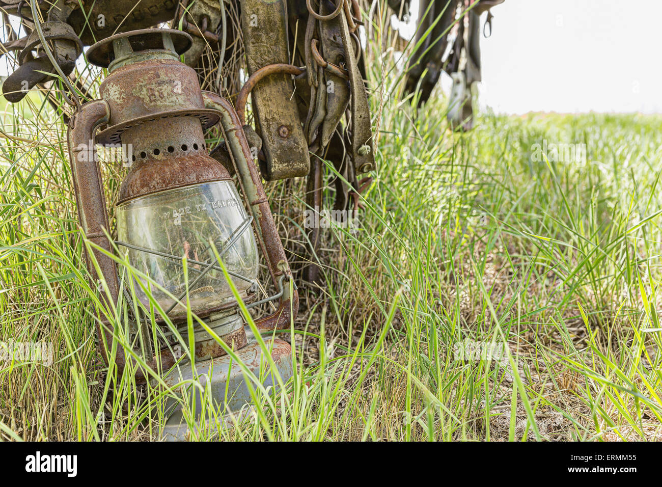 An old lantern lay against a post in rural Saskatchewan; Val Marie ...