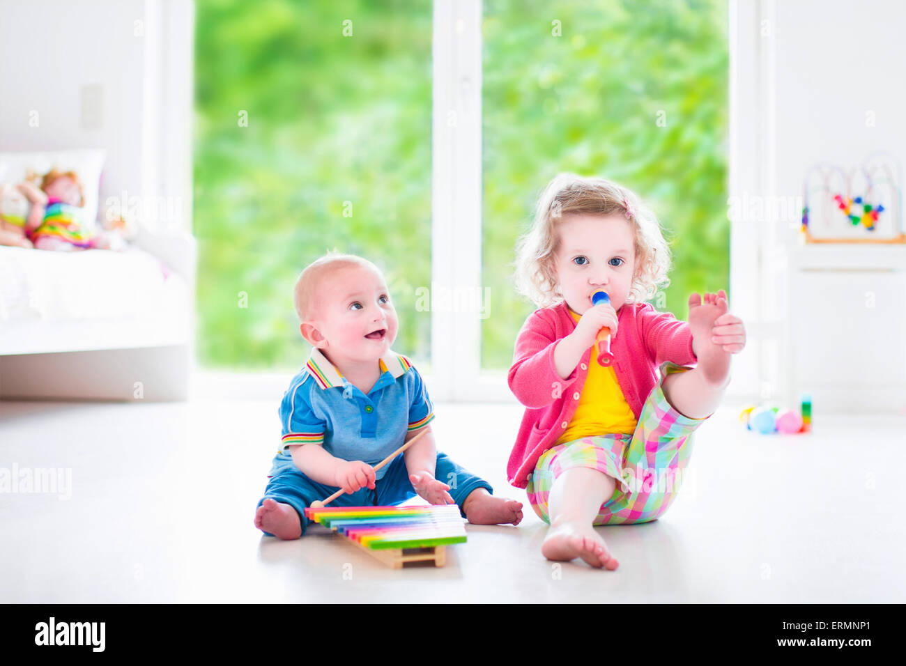 Two children cute curly toddler girl and funny baby boy, brother and