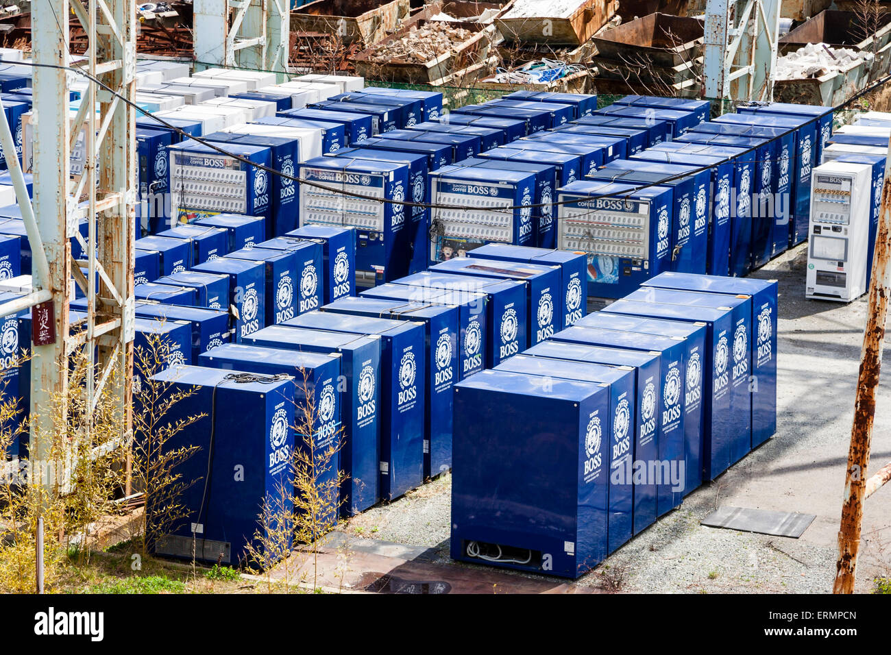 Old blue Suntory Boss Coffee vending machines stacked in Old blue Suntory Boss Coffee vending machines stacked in