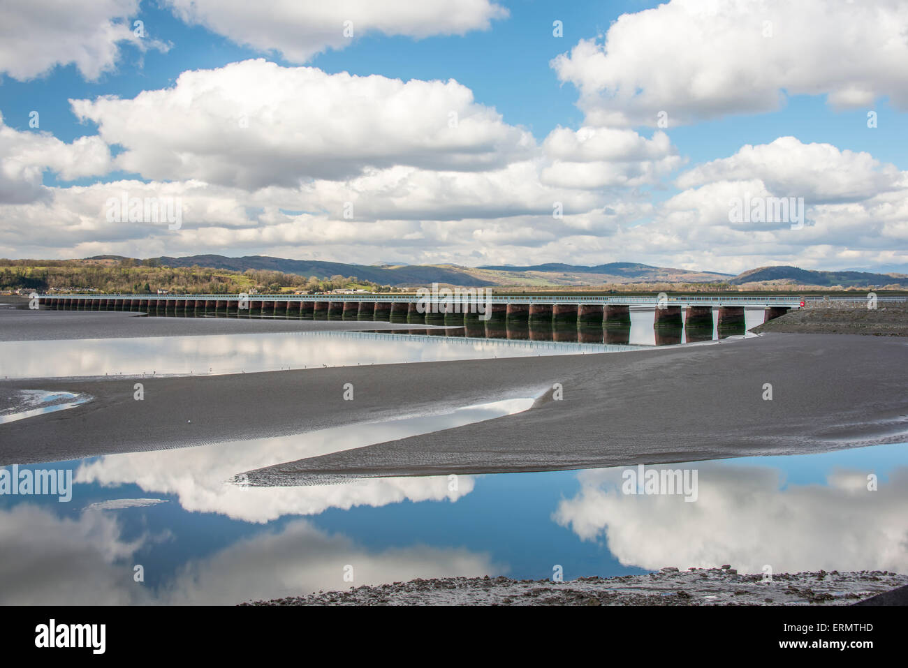 A long railway viaduct which stretches across the sands of kent Bay in the Cumbrian town of Arnside Stock Photo