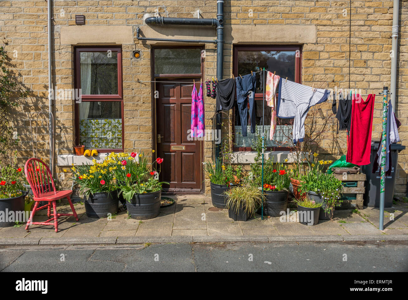 Washing hanging out to dry outside of a trerraced house in the Yorkshire town of hebden Bridge Stock Photo