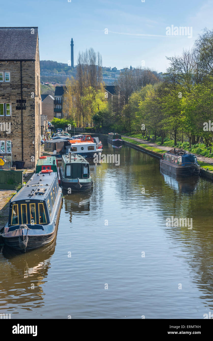 View along the rochdale canal from sowerby bridge in west yorkshire looking towards the victorian folly known as wainhouse tower Stock Photo