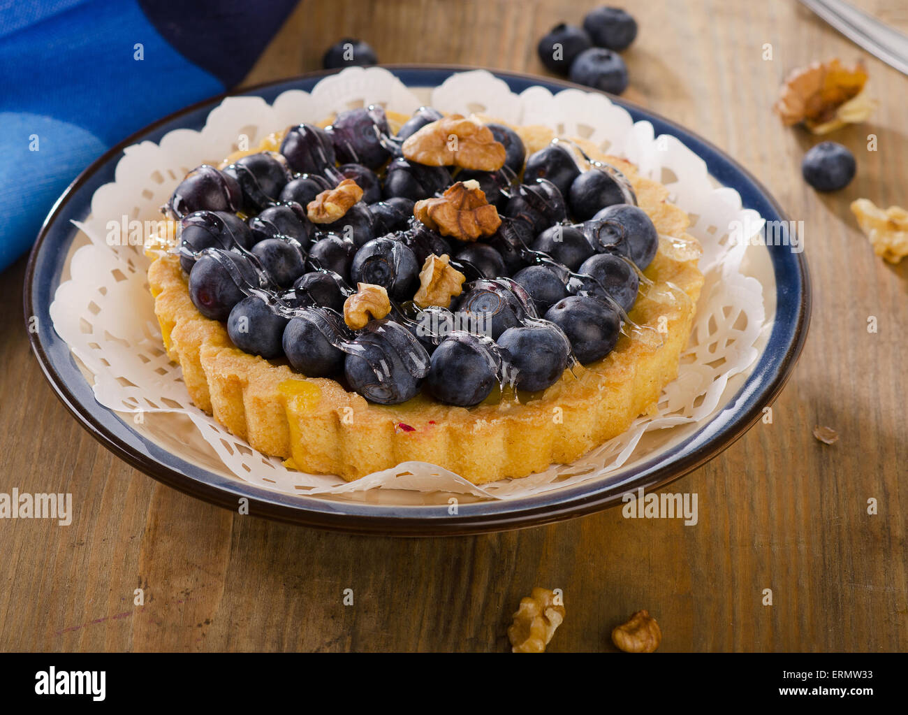 Tasty tart with blueberries  on a wooden table. Stock Photo