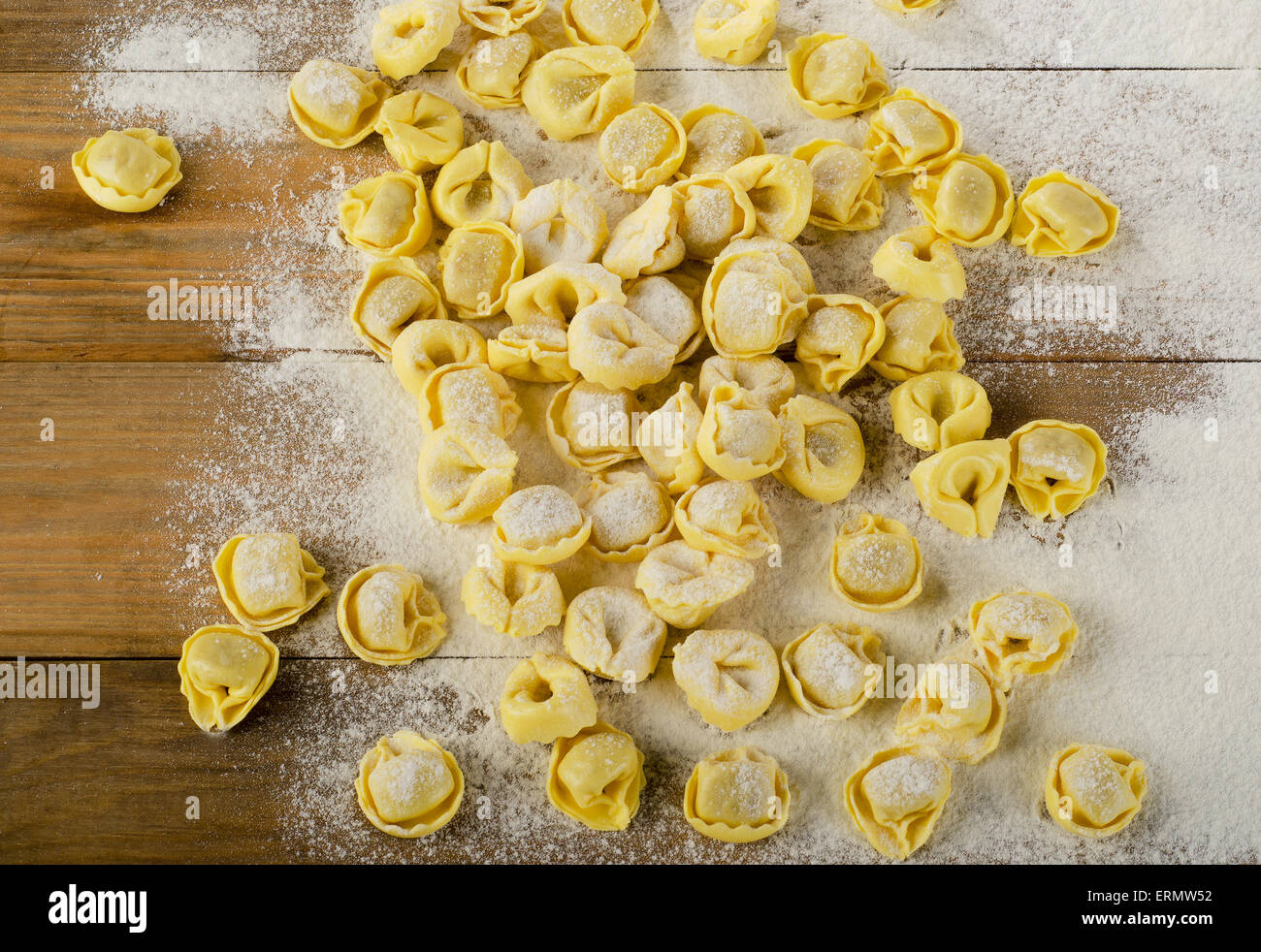 Freshly Made Ravioli on  wooden background. Top view Stock Photo