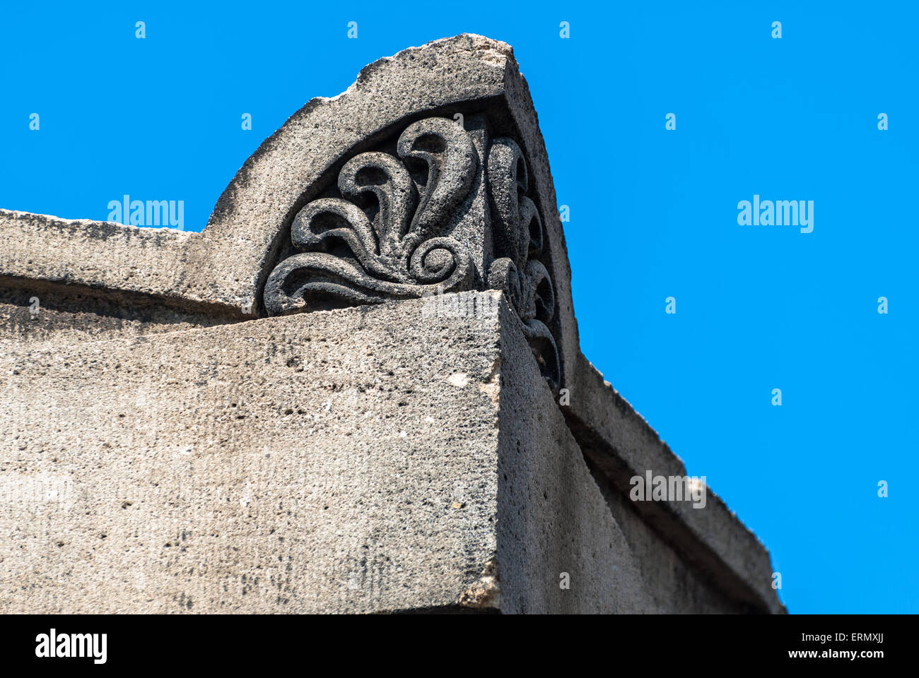 Corner stone with decorative ocean wave motif. Stock Photo