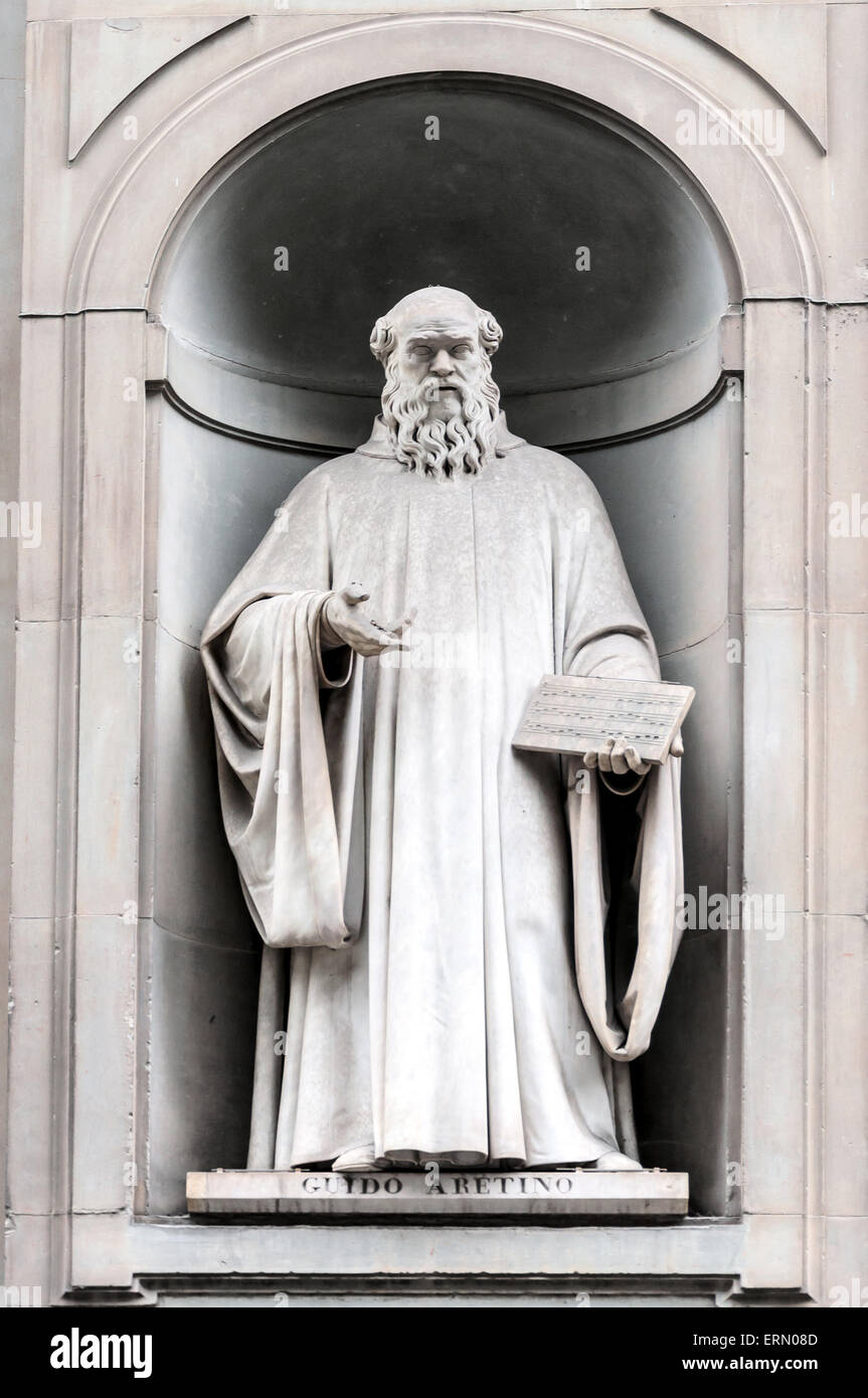 Statue of Guido Aretinus in Uffizi gallery, seen in Lungarno degli Archibusieri street. Florence, Italy Stock Photo