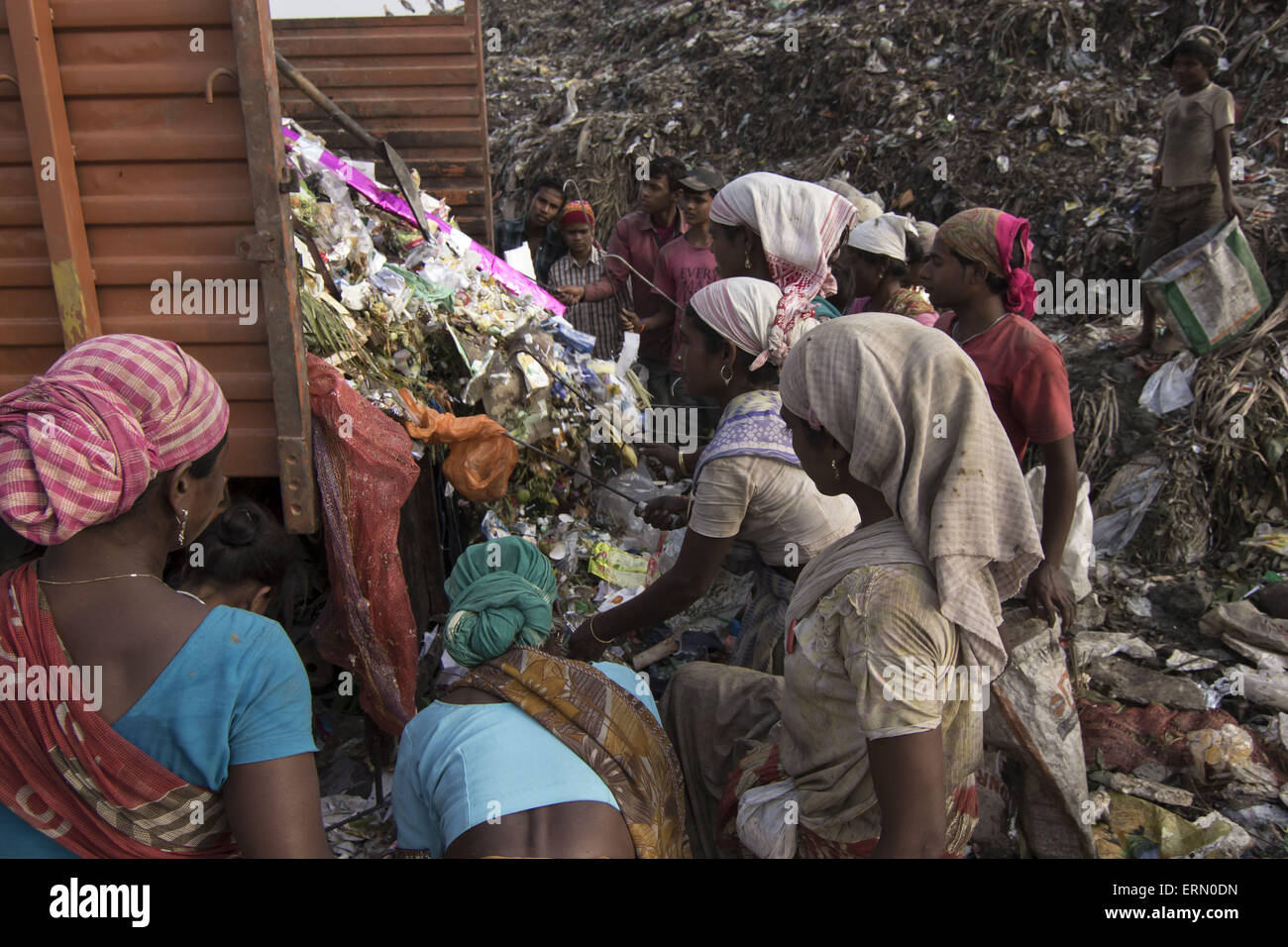 Guwahati, Assam, India. 5th June, 2015. Indian ragpickers look for