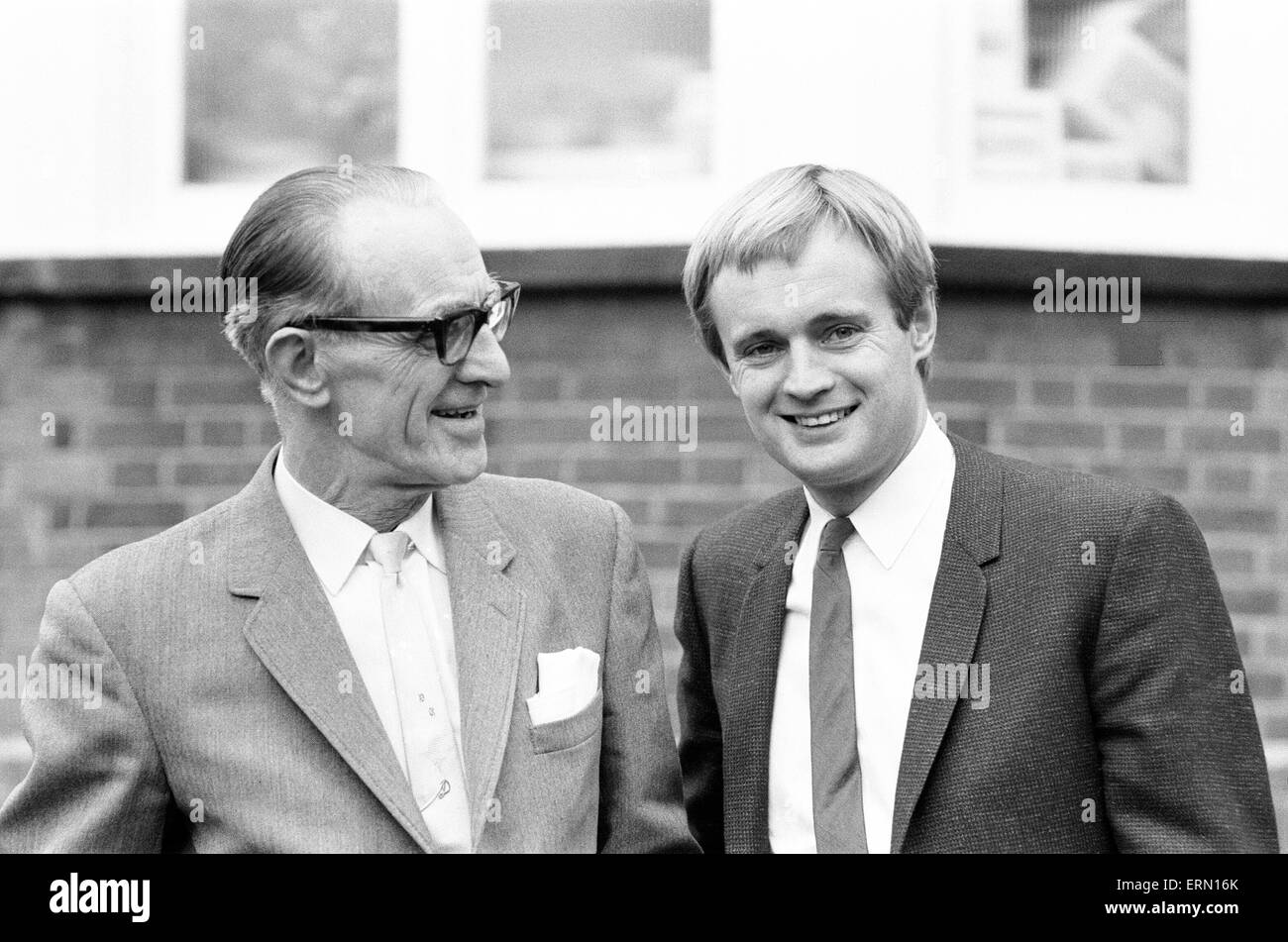 David McCallum, actor who plays the role of secret agent Illya Kuryakin in NBC show The Man from U.N.C.L.E., pictured at home of parents in Hampstead, London, 16th March 1966. UK Promotion Tour. Standing with father David Snr. Stock Photo