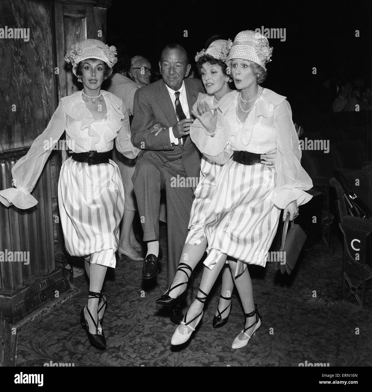 Kay Kendall left, enjoying a dance with ( left to right) Noel Coward, Joyce Grenfell and Margaret Leighton during rehearsals for the 'Night Of 100 Stars' charity performance at the London Palladium. 22nd July 1958 Stock Photo