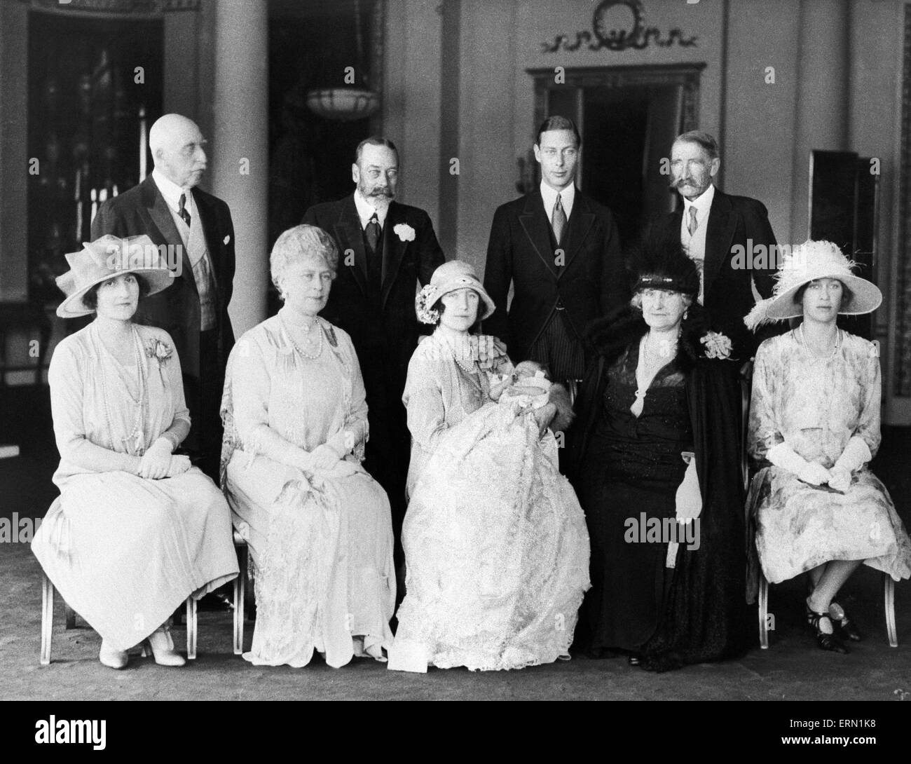 The duke and Duchess of York, (the future King George VI and Queen Elizabeth) pose with their baby daughter Princess Elizabeth at her christening ceremony at Buckingham Palace surrounded by family members King George V, Queen Mary, the Duke of Connaught, Princess Mary and the Earl and Countess of Strathmore. May 1926. Stock Photo