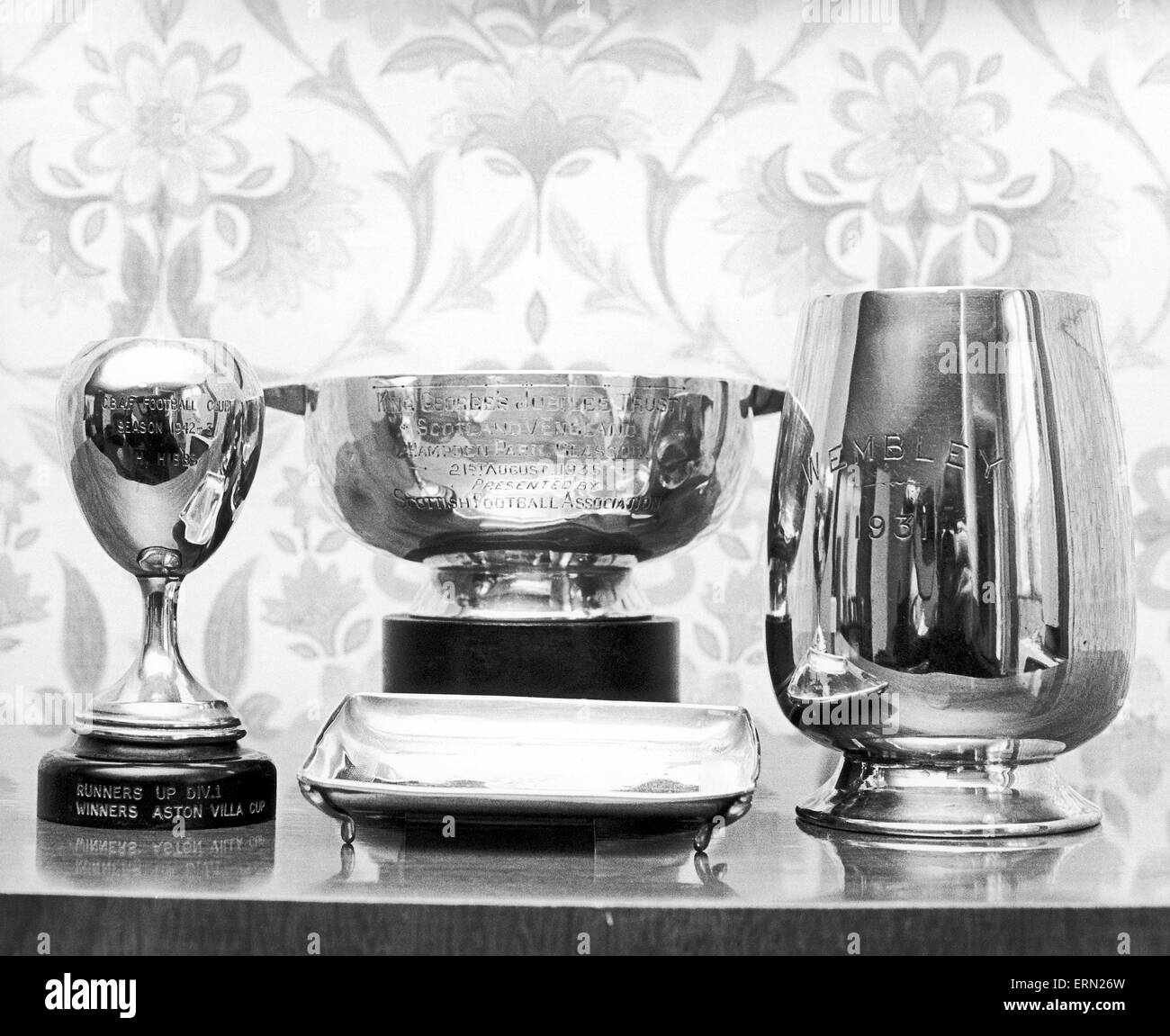 Trophies belonging to former Birmingham City and England goalkeeper Harry Hibbs at his home. Circa 1965. Stock Photo