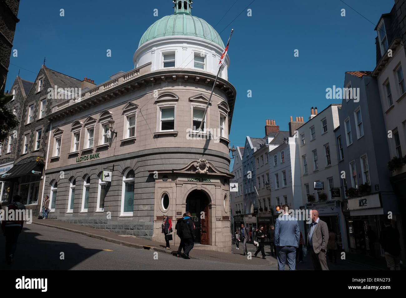 lloyds bank,  high street St Peter port Guernsey modern day view that matches an old picture from the occupation of german soldiers marching in street Stock Photo