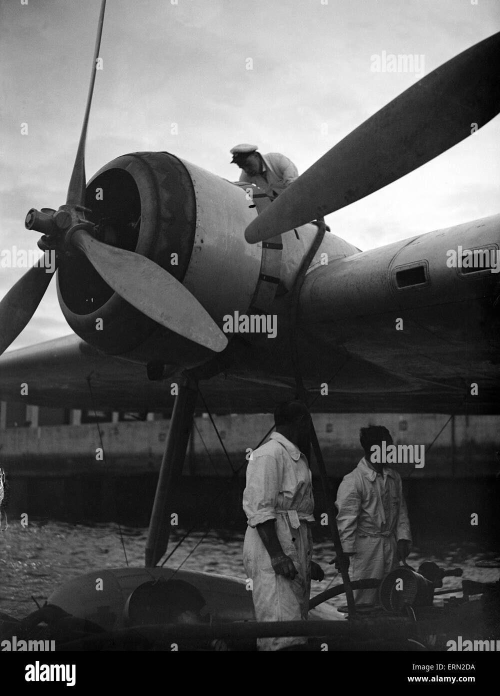 Series of images for Daily Herald Feature flight to Australia. 26th June 1938 Imperial Airways staff check the Bristol Pegasus Xc poppet valve radial engines of the Shorts C Class Empire Flying Boat G-AEUD Cordelia prior to its flight for Brisbane at Sout Stock Photo