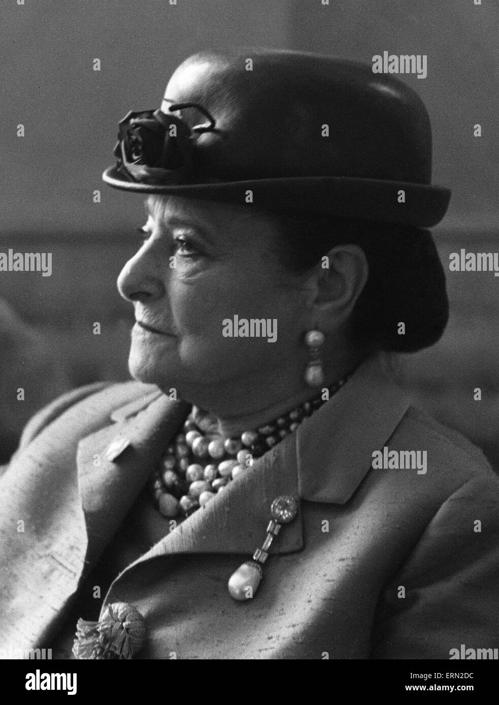Business woman Helena Rubinstein seen here at the Dorchester Hotel, London, with couturier and dressmaker to the Queen, Hardy Amies. Rubinstein was at a lunch given by her niece Maxla in her honour.  14th May 1963 Stock Photo