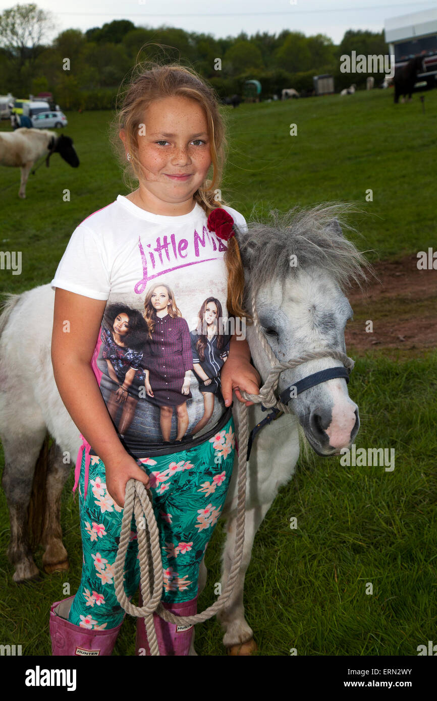 Appleby, Cumbria, Uk. 5th June, 2015.  Nikita Price, 10 years old with her pony at the Appleby Horse Fair in Cumbria.  The Fair is an annual gathering of Gypsies and Travellers which takes place on the first week in June, and has taken place since the reign of James II, who granted a Royal charter in 1685 allowing a horse fair 'near to the River Eden', and is the largest gathering of its kind in Europe. Stock Photo