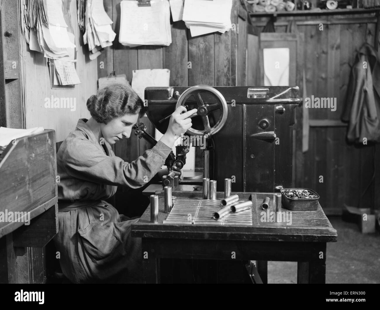 A women examines the bolts used in the construction of the Miles 3 Falcon aircraft at the Philips and Powis factory at Woodley Aerodrome, Reading  2nd April 1934 Stock Photo