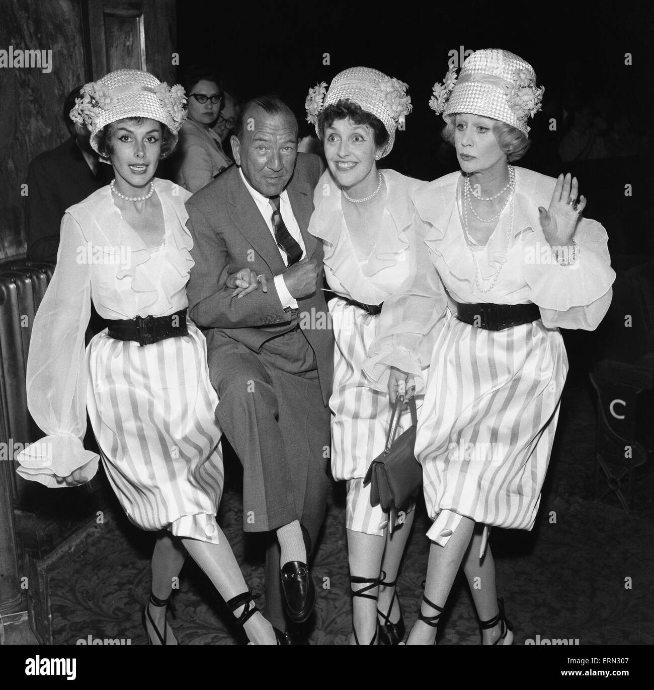 Kay Kendall left, enjoying a dance with ( left to right) Noel Coward, Joyce Grenfell and Margaret Leighton during rehearsals for the 'Night Of 100 Stars' charity performance at the London Palladium. 22nd July 1958 Stock Photo