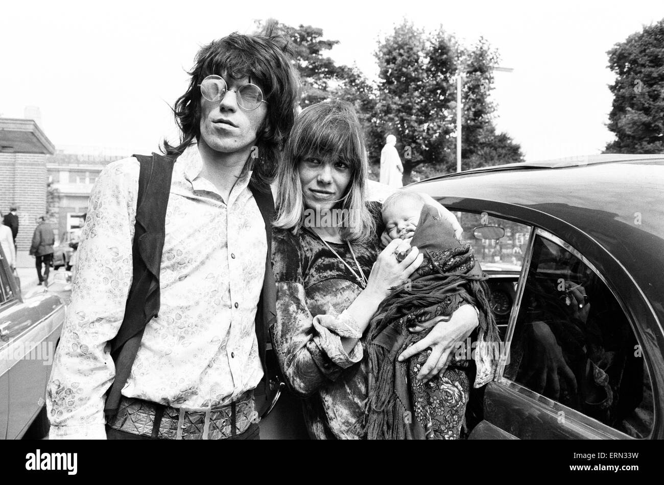Keith Richards, and Anita Pallenberg, with baby son Marlon, born Sunday 10th August, leave King's College Hospital, London, Monday 18th August 1969. Stock Photo