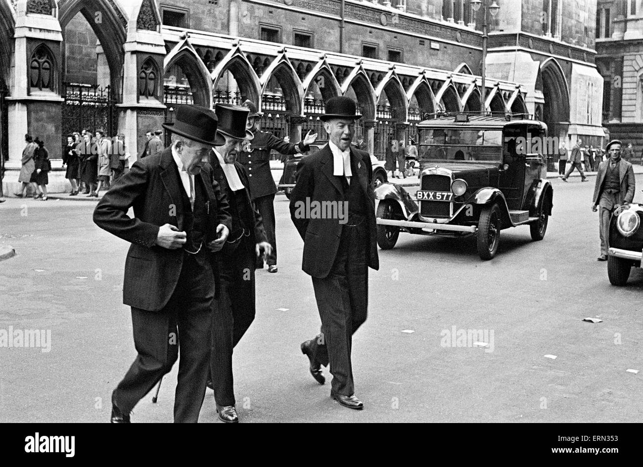 Day in the life of the Temple May 4th 1948 The Temple is one of the main legal districts of the capital and a notable centre for English law, both historically and to present day. Two of the four Inns of Court, the Inner Temple and the Middle Temple, are located here and the Royal Courts of Justice are just to the north.  Our Picture Shows: Barristers crossing the road outside the Royal Courts of Justice Stock Photo