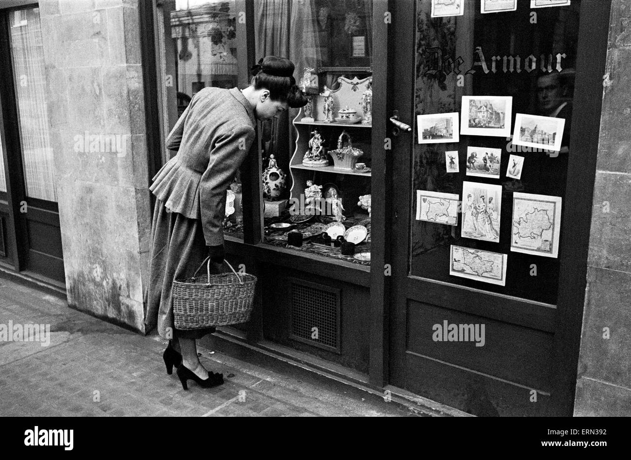 Day in the Life of Shepherds Market circa 1948 Local resident window shopping at No 13 Shepherds market Stock Photo