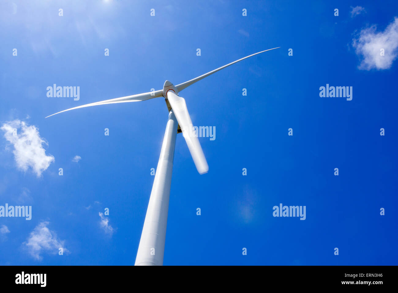 a detail turbine of a wind farm with a blue sky Stock Photo - Alamy