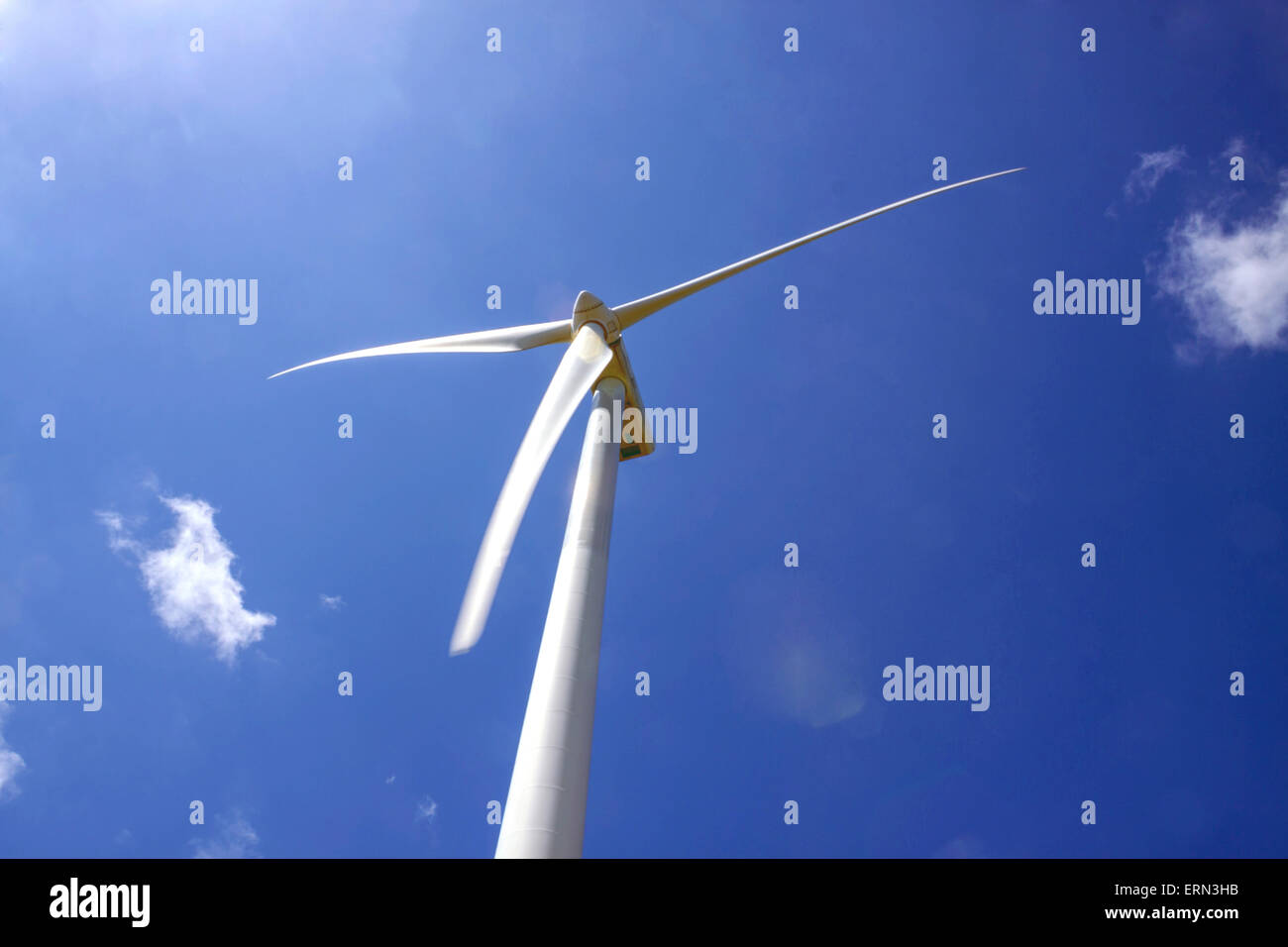 a detail turbine of a wind farm with a blue sky Stock Photo - Alamy