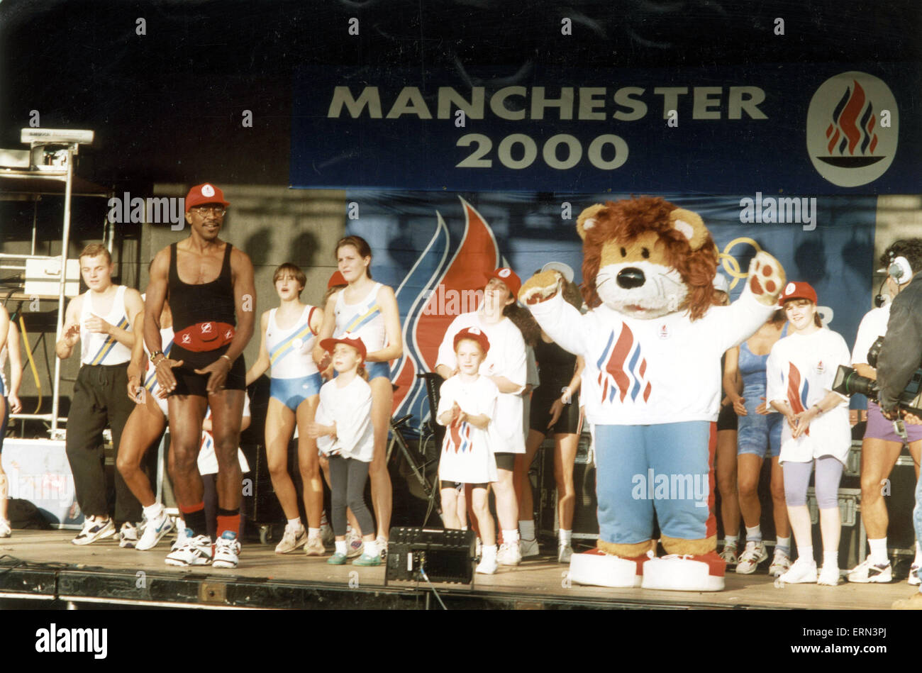 Manchester 2000 Olympic Bid, Crowds await official announcement on who will be hosting the 2000 Olympic Games, Decision Day, 23rd September 1993. Pictured. Mr Motivator, Derrick Evans and Mascot on stage. Stock Photo