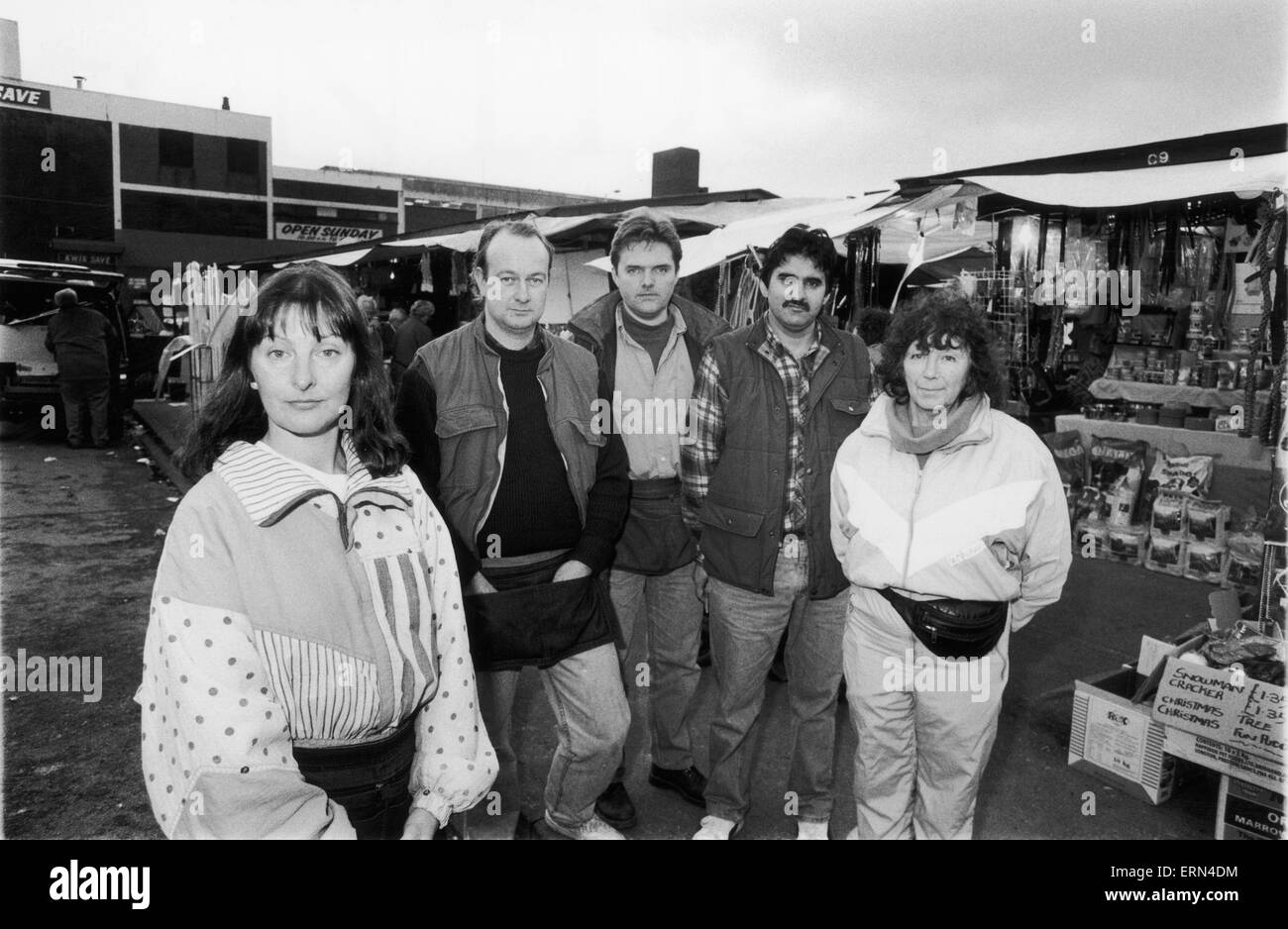 Stallholders at the Wythenshawe Market seen here posing for the camera. The market traders are furious with the Council after a parking ban has driven business away in the lead up to Christmas. Left to Right Sue Husdon, Derek Hamnett, Martin Osborne, M Mahmod and Pat Wilkinson. 16th December 1994 Stock Photo
