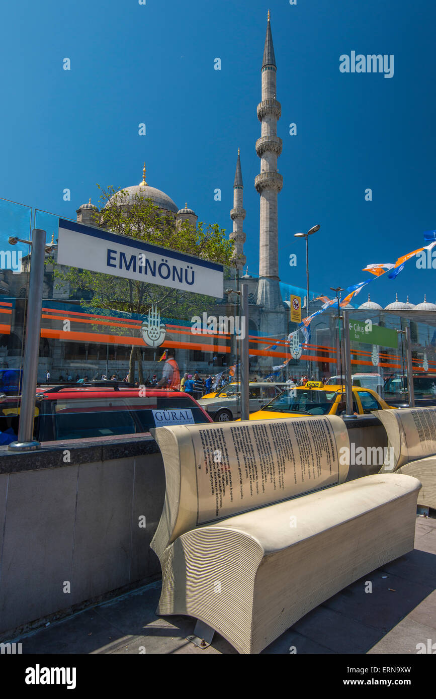 Open book shape bench at Eminonu tram station with Yeni Cami or New Mosque behind, Istanbul, Turkey Stock Photo