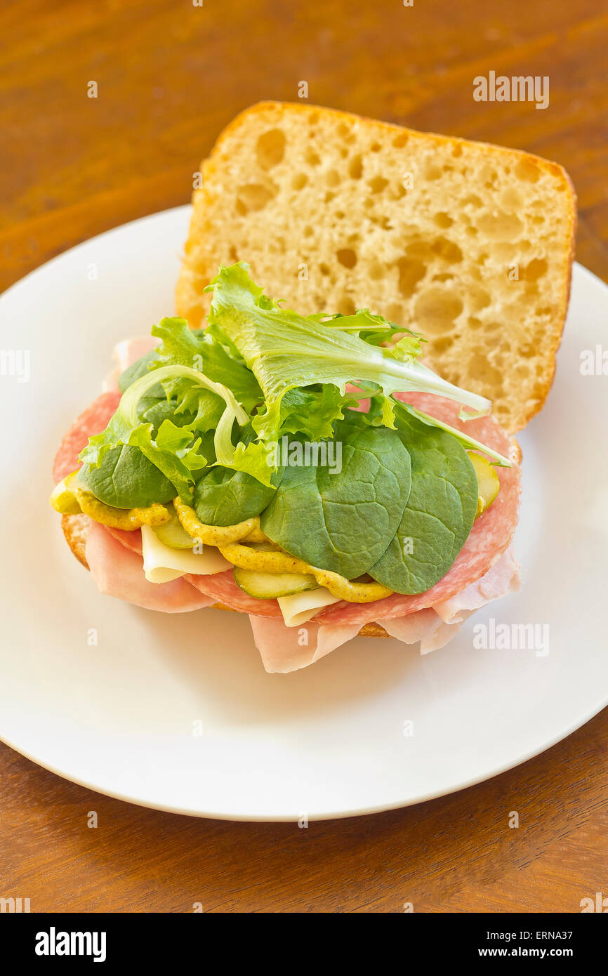 Ciabatta roll Italian meat sub sandwich with provolone ham and salami