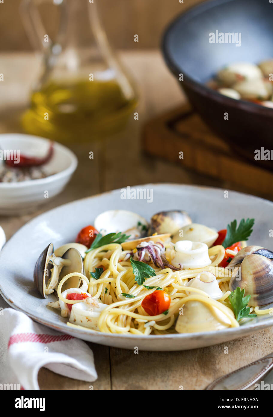 Spaghetti with squid, clam and prawn by sea salt Stock Photo