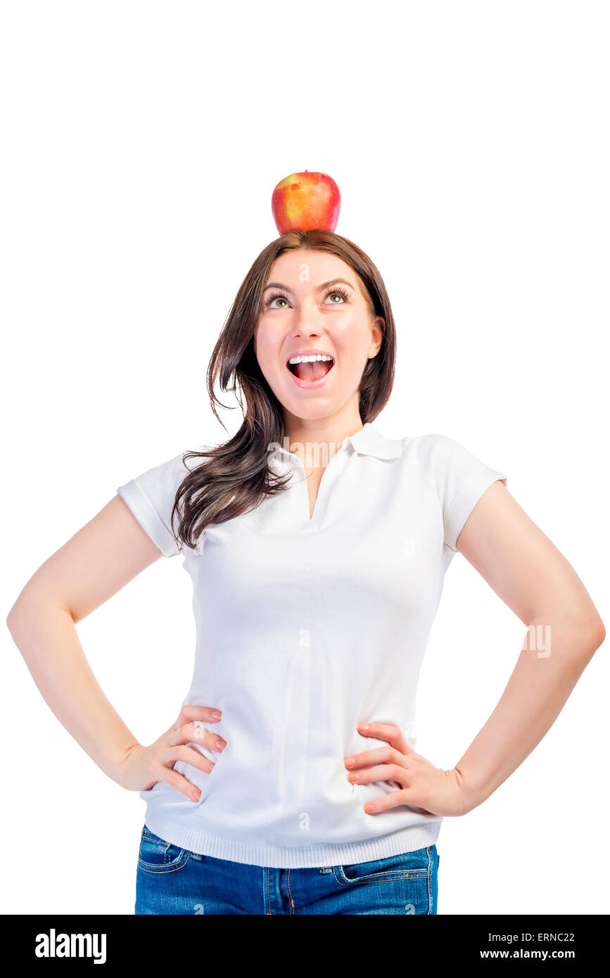 Funny girl with apple on her head on a white background Stock Photo