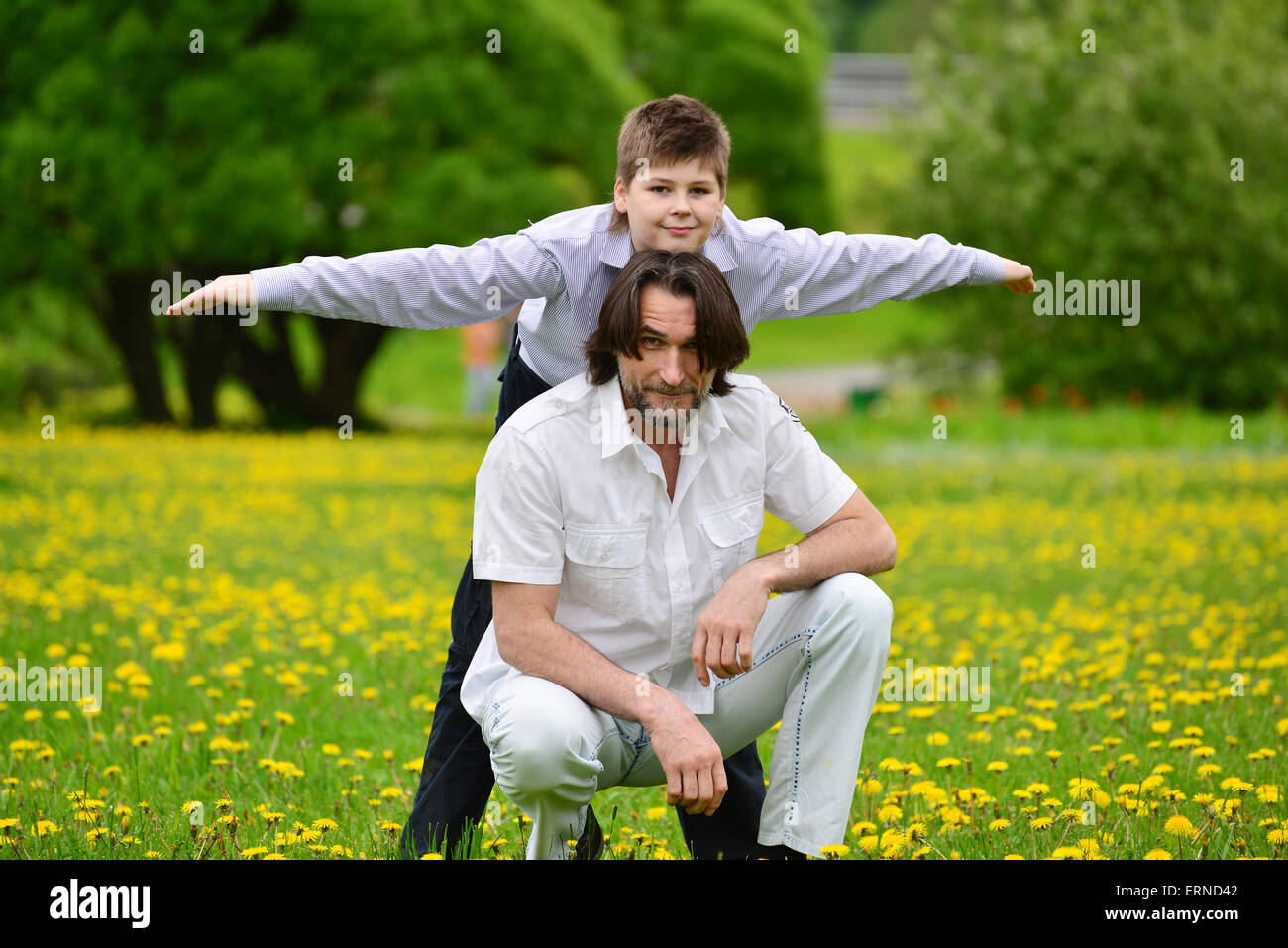 Father and son in the summer park Stock Photo