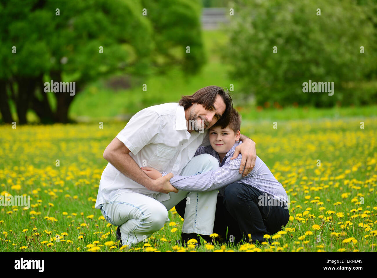 Father and son in the summer park Stock Photo
