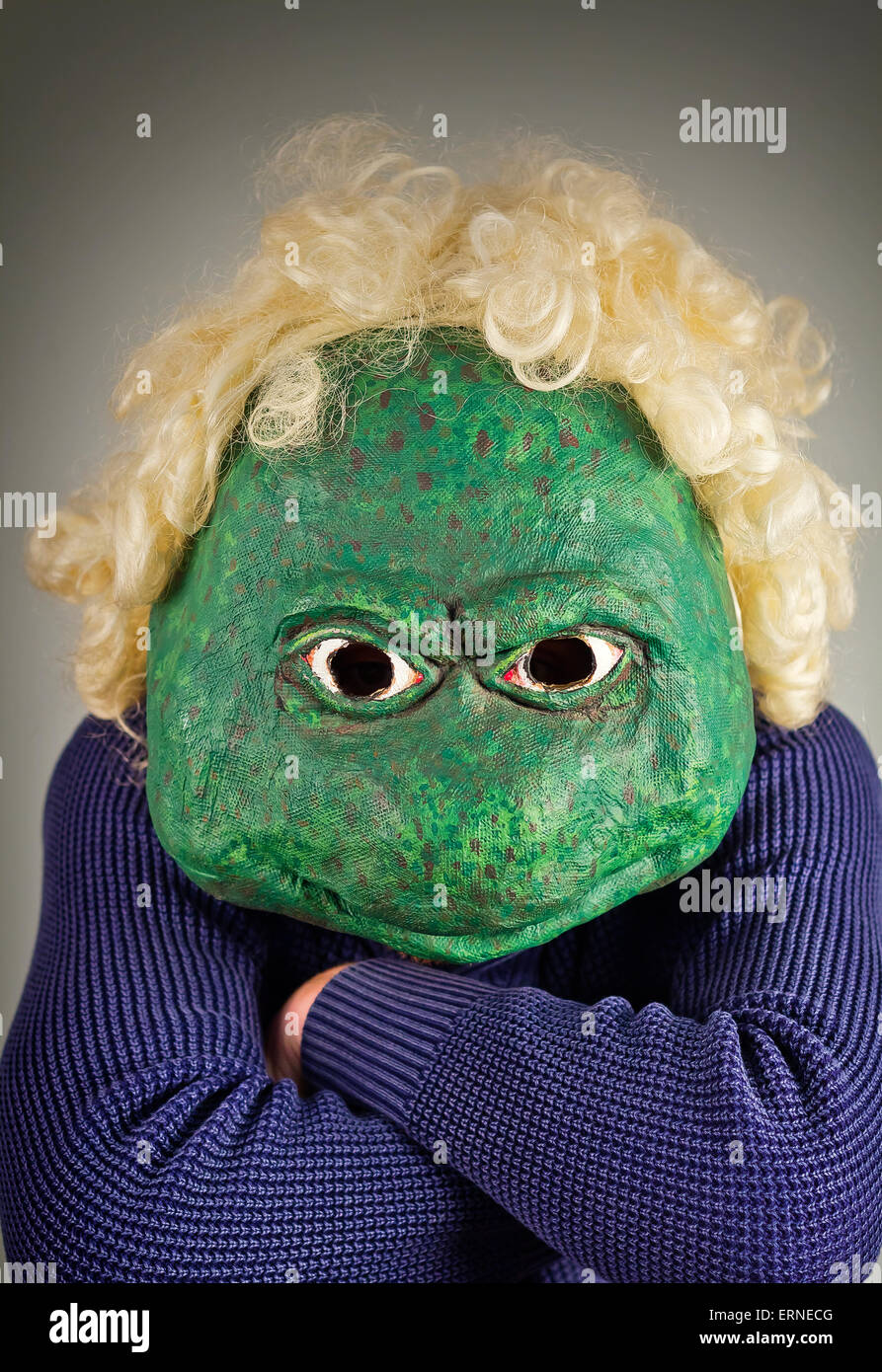 Creepy bald lizard man wearing a blue sweater Stock Photo - Alamy