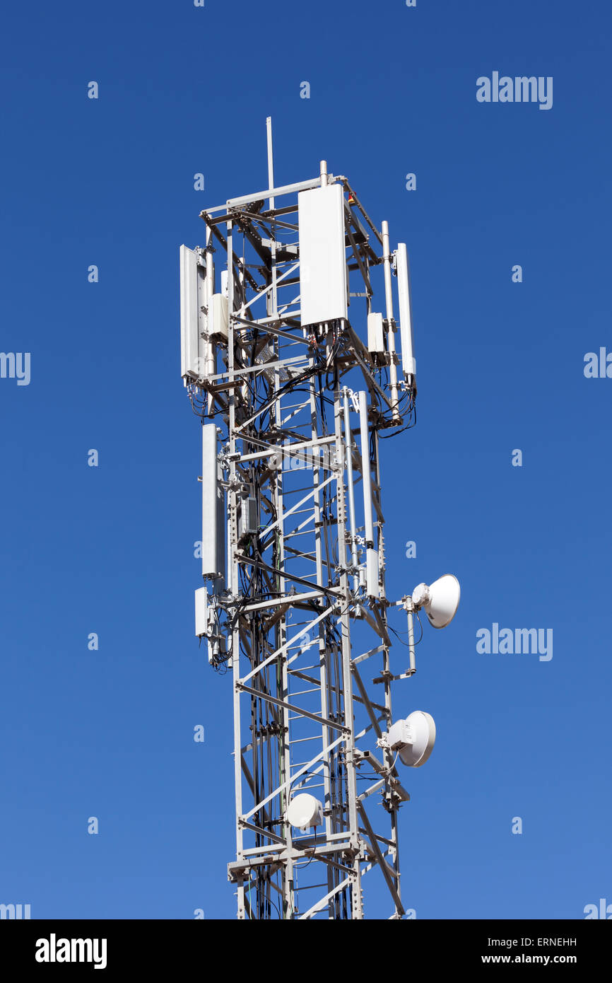 Communication tower with cellular network antennas Stock Photo