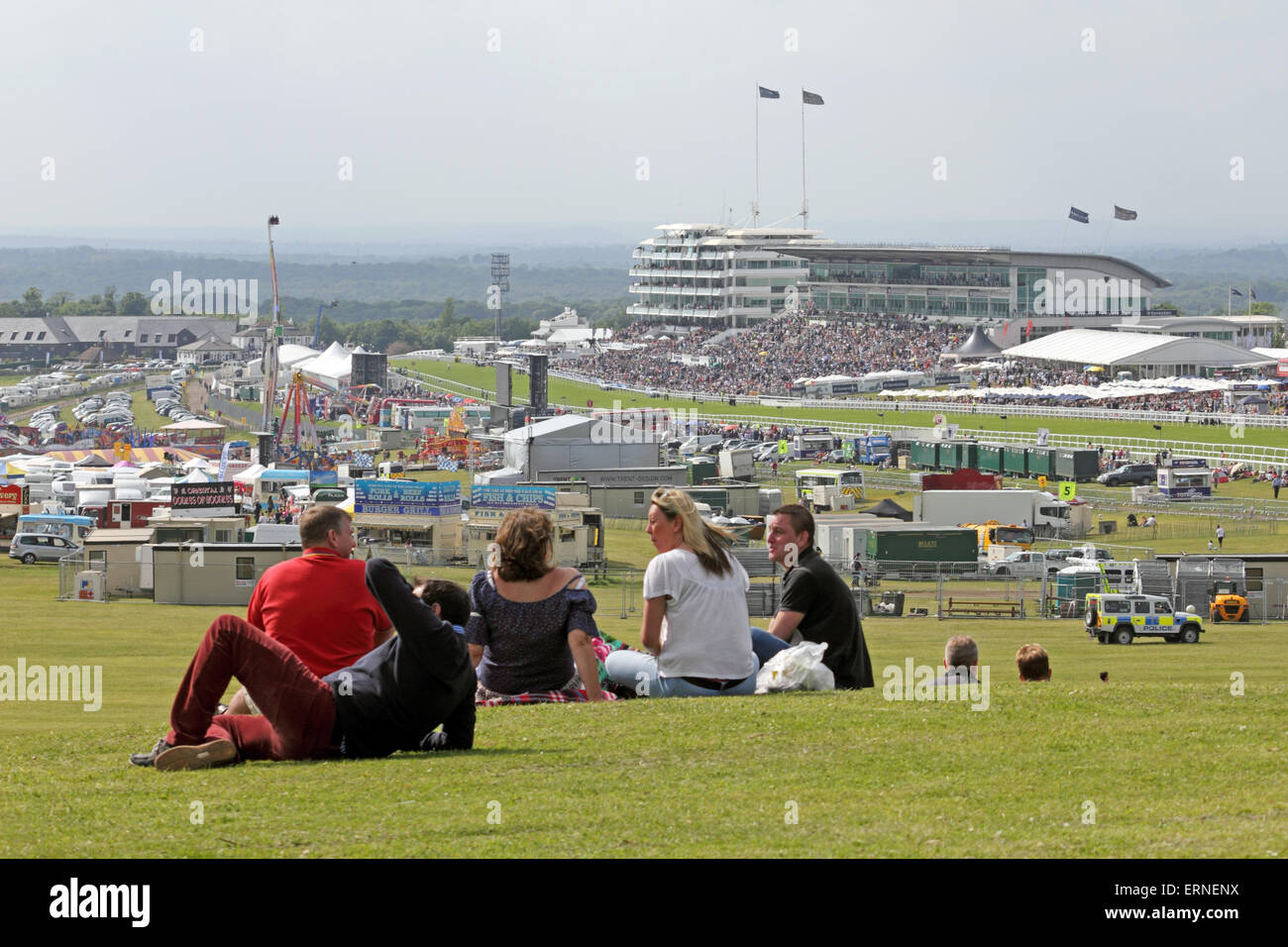 Epsom Downs Surrey UK. 5th June, 2015. It was Ladies Day 2015 at Epsom, with the highlight of the day being the Investec Oaks (Fillies' Group 1, Class 1), run over a distance of 1m 4f 10y. The 5/2 favourite No. 8 (orange and blue colours) Legatissimo was beaten into second place by the photo finish winner, No 9 (red and yellow colours) and 20/1 outsider Qualify, ridden by C O'Donoghue and trained by A P O'Brien. Spectators on the mound at Tattenham Corner with a free view of the the whole course. Credit:  Julia Gavin UK/Alamy Live News Stock Photo