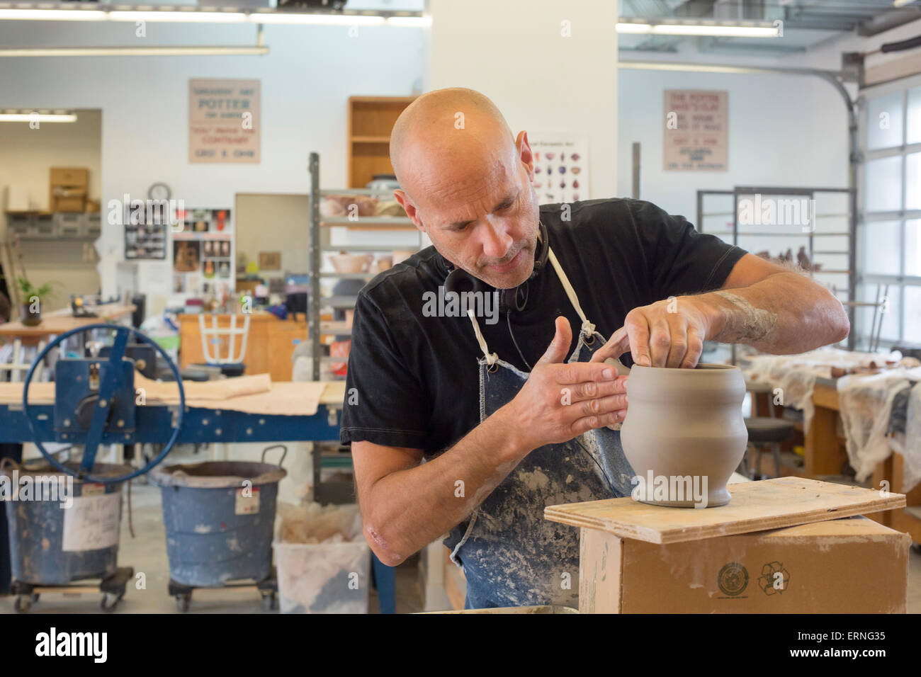 Biloxi, Mississippi - A potter works in the City of Biloxi Center for Ceramics at the Ohr-O'Keefe Museum of Art. Stock Photo