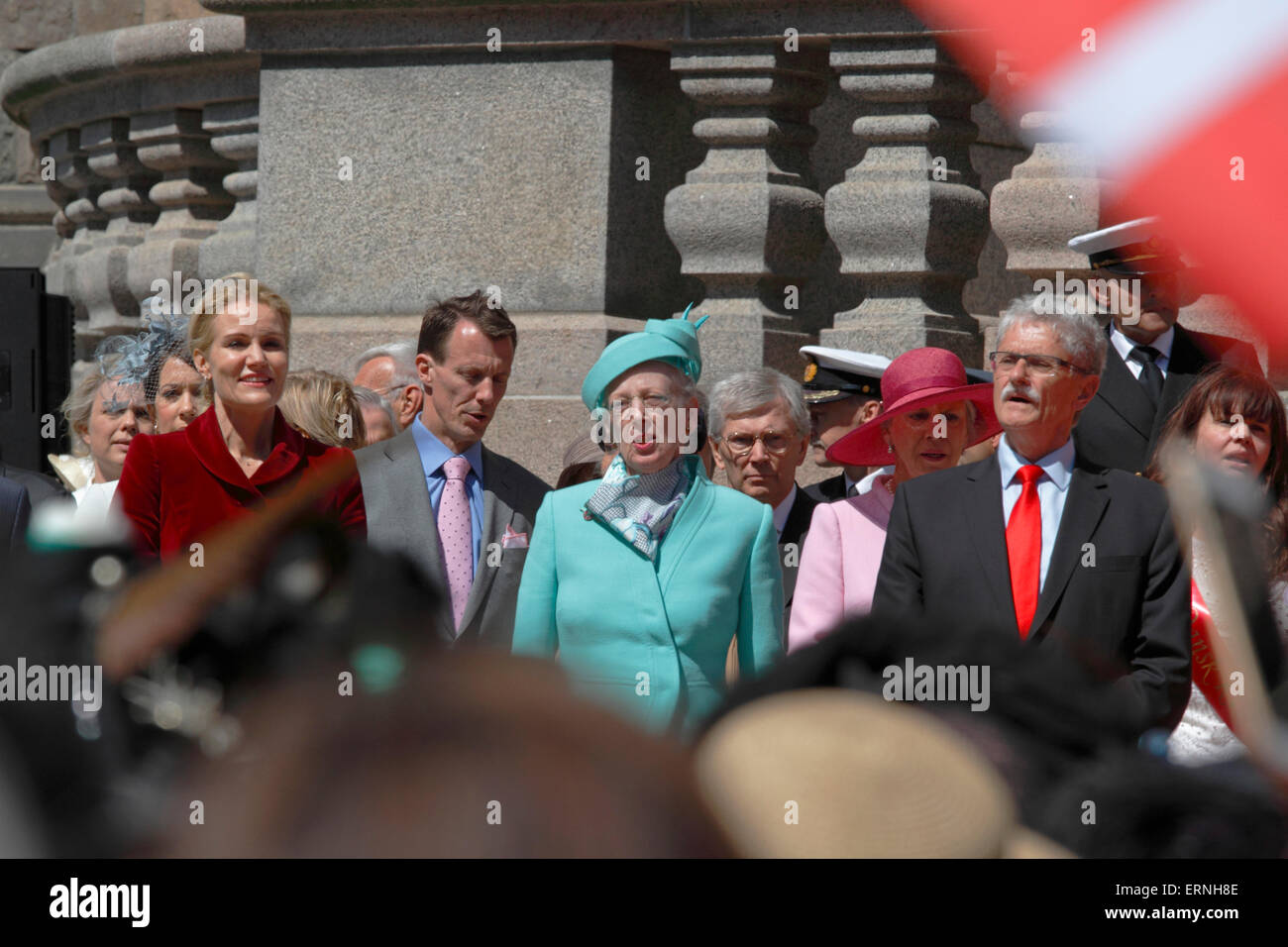 Copenhagen, Denmark, 5th June, 2015. Prime Minister Helle Thorning-Schmidt, Prince Joachim, H.M. Queen Margrethe II of Denmark and the Speaker of Parliament Mogens Lykketoft in the singing of the national anthem after receiving the commemorative parade in historic garments and speeches in celebration of the 100th anniversary of the constitution amendment that gave Danish women the right to vote and stand for election in 1915. Credit:  Niels Quist/Alamy Live News Stock Photo