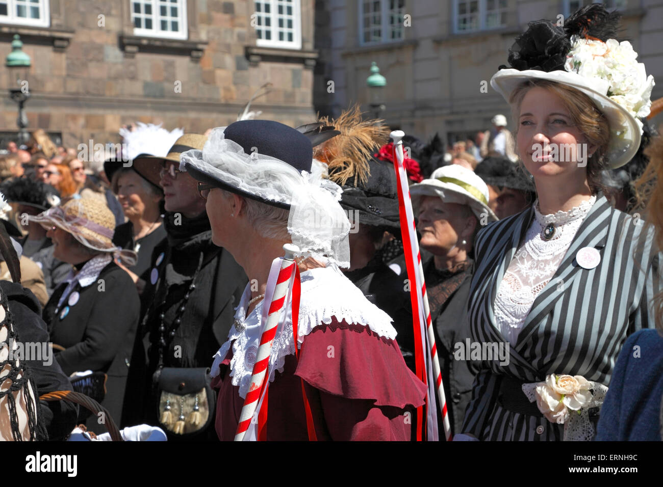 Copenhagen, Denmark, 5th June, 2015. The amendment of the Danish Constitution in 1915 gave Danish women the right to vote and stand for election. This important anniversary is celebrated in Copenhagen on the Constitution Day by the Government, the Parliament and the ongoing Distortion Festival in Copenhagen. A commemorative parade takes place very similar to the original one in 1915, many of the participants are in historic garments. This is at the finish point of the parade in the Christiansborg Palace Yard before the official speeches. Credit:  Niels Quist/Alamy Live News Stock Photo