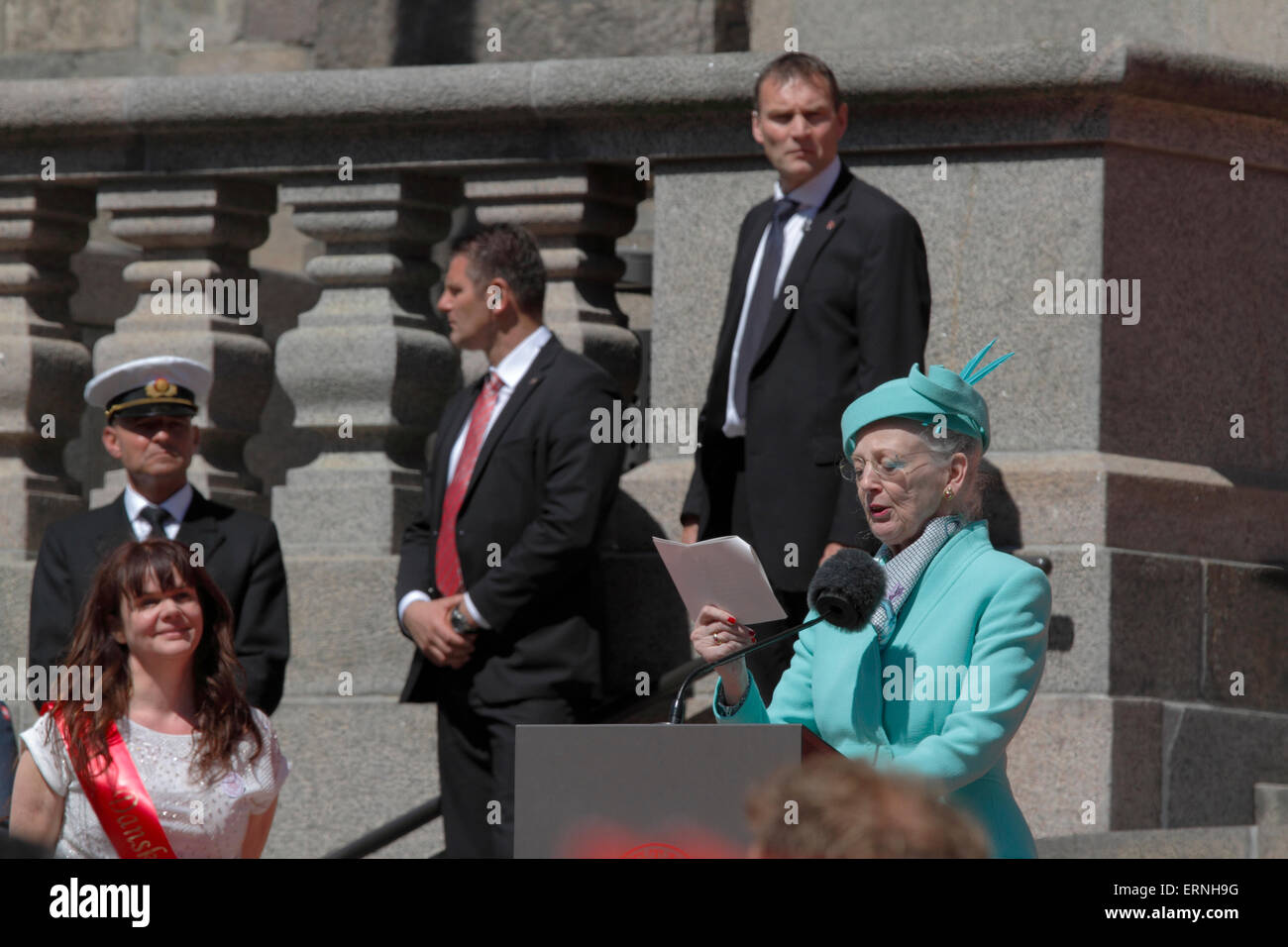 Copenhagen, Denmark, 5th June, 2015. H.M. Queen Margrethe II of Denmark speaks in the Christiansborg Palace yard at the finish point of the commemorative parade in celebration of the 100th anniversary of the constitution that gave Danish women the right to vote and stand for election. The parade showed historic garments that would have been worn in the original parade in 1915. Credit:  Niels Quist/Alamy Live News Stock Photo
