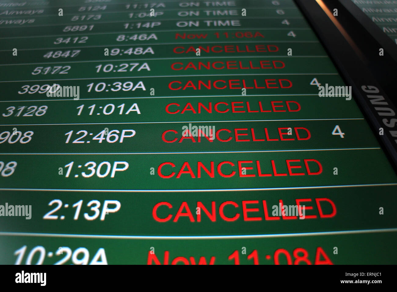 Canceled flights on airport flight status board Cincinnati Stock Photo